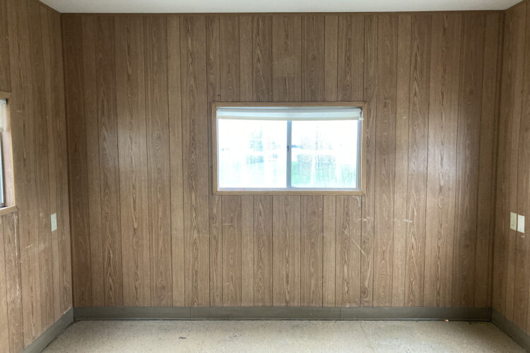 Windows in a wood paneled mobile office